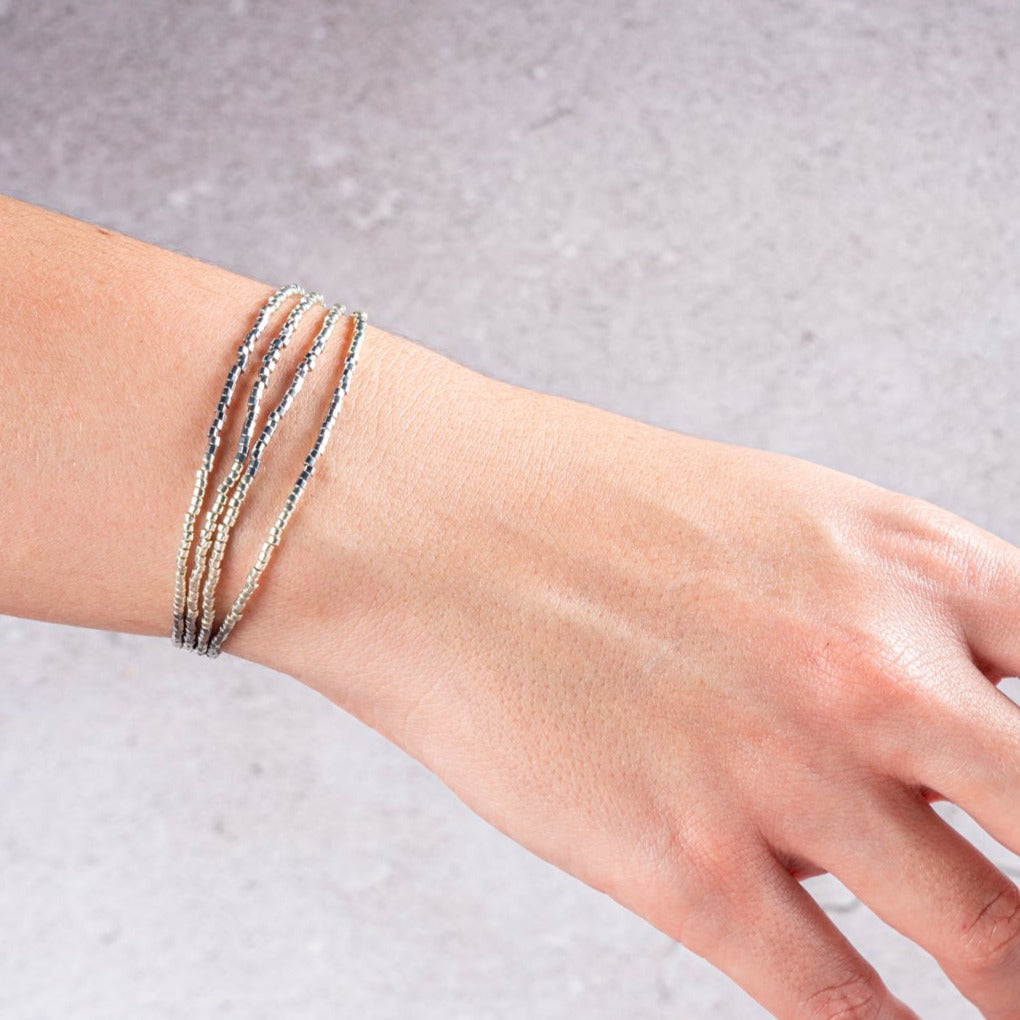 PULSERA LAUREL DORADA CON ORO BLANCO